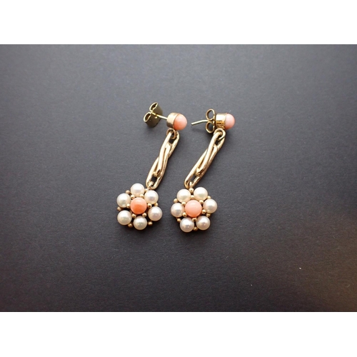 171 - A pair of Coral and Cultured Pearl Ear Pendants each set coral bead suspending bar terminating in da... 