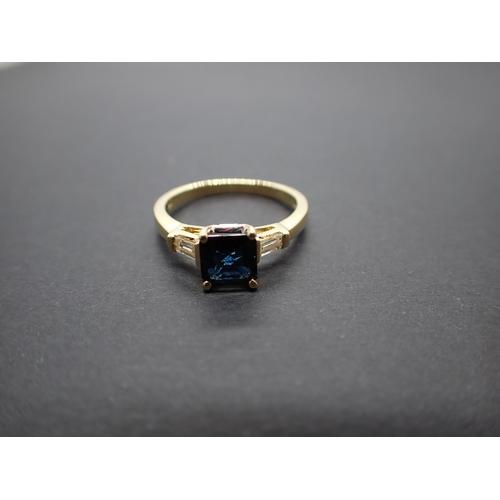 179 - A Sapphire and Diamond three stone Ring corner claw-set step-cut square sapphire, 1.10cts, between t... 