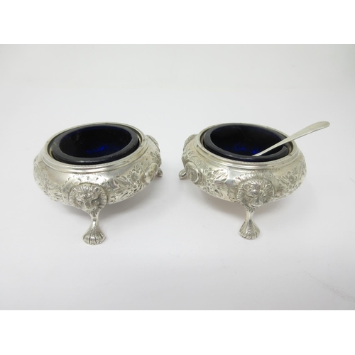 202 - A pair of Victorian silver Cauldron Salts with floral embossing, lion masks and paw feet, Birmingham... 