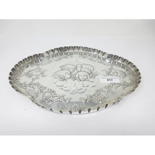 217 - An Edward VII silver shaped oval Dressing Table Tray embossed cherub masks and leafage scrolls, Ches... 