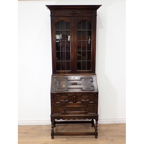 26 - A moulded oak and lead glazed Bureau Bookcase 6ft 10in H x 2ft 5in W