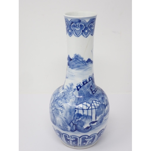 264 - A Chinese blue and white narrow necked Vase decorated with buildings in landscape 10in