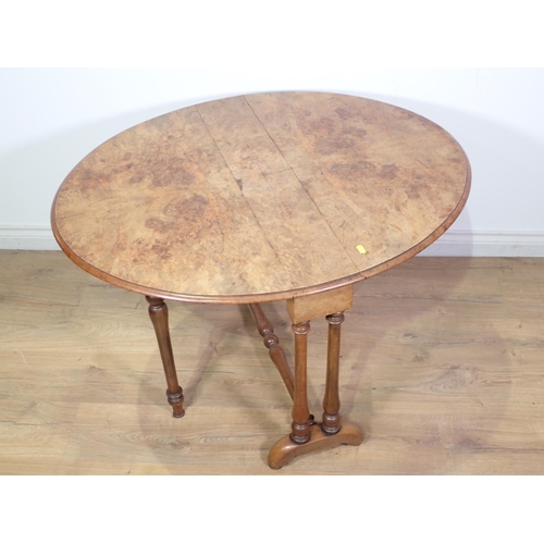 265 - A Victorian walnut oval Sutherland Table 2ft 9in x 2ft 2in