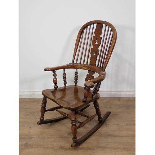 282 - An antique ash and elm pierced splat back Rocking Chair 3ft 5in x 2ft 1in