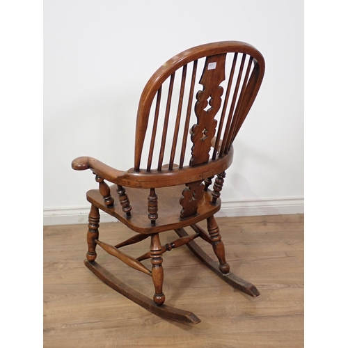 282 - An antique ash and elm pierced splat back Rocking Chair 3ft 5in x 2ft 1in