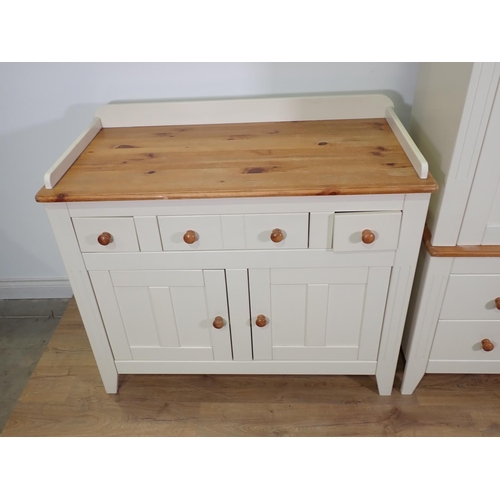 287 - A cream painted Press Cupboard, a matching Dresser and a beechwood High Chair