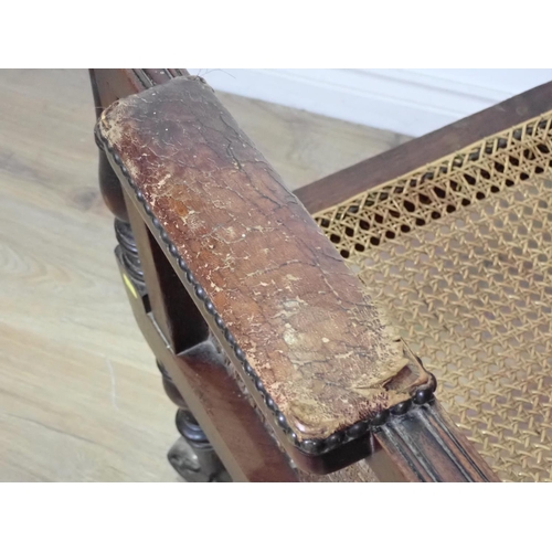 292 - A 19th Century mahogany framed Library Chair with cane infill on brass casters 3ft 8in x 2ft 1in