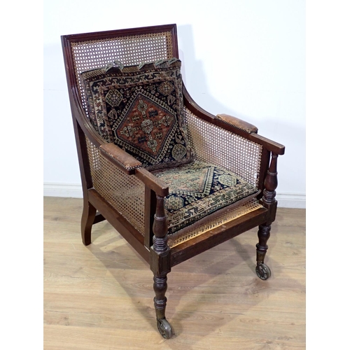 292 - A 19th Century mahogany framed Library Chair with cane infill on brass casters 3ft 8in x 2ft 1in