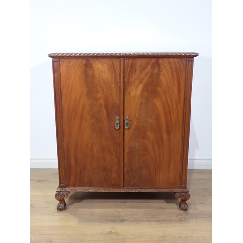 299 - A mahogany veneered two door Cupboard on claw and ball feet 3ft 6in x 3ft