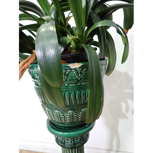 310 - A green glazed Jardiniere on stand 2ft 8in A/F