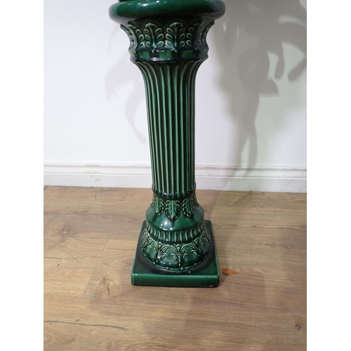 310 - A green glazed Jardiniere on stand 2ft 8in A/F