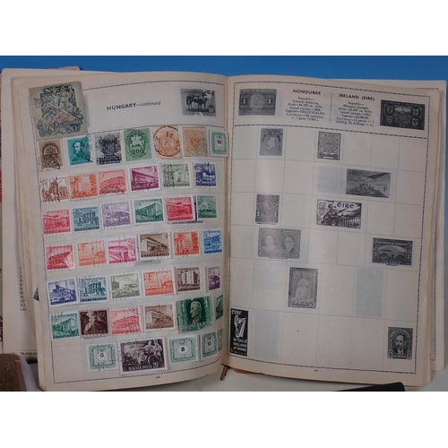 462 - Three various Stamp Albums, an album of Cigarette Cards and an album of Postcards