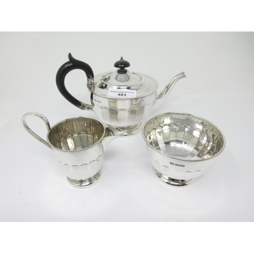 483 - A George VI silver three piece Tea Service of panelled circular form, Sheffield 1937, etc, 710 gms