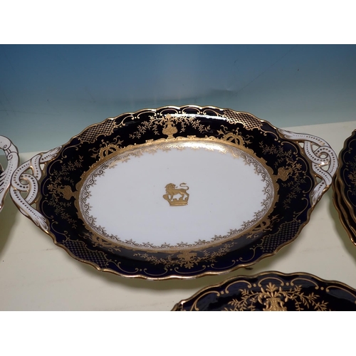 494 - A Coalport 11 piece Dessert Service, each piece with central gilt crest and profusely gilt borders o... 