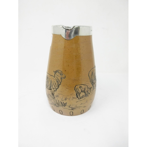 51 - A Royal Doulton stoneware Jug with incised decoration of Sheep in landscape by Hannah Barlow, silver... 