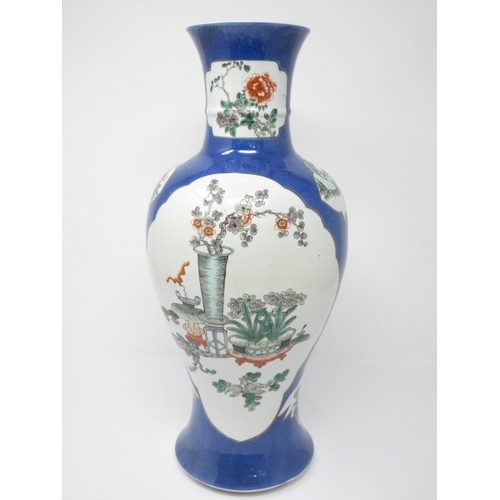 54 - A Chinese baluster Vase with shaped reserves, painted utensils and bird amongst flowering shrub, pow... 