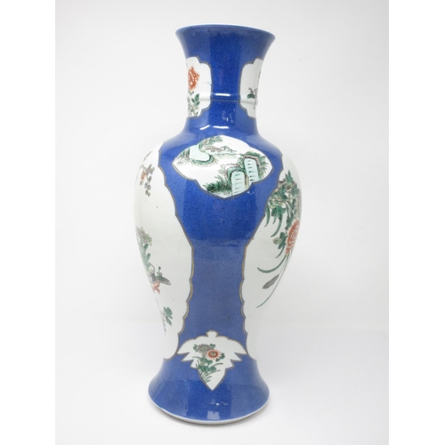 54 - A Chinese baluster Vase with shaped reserves, painted utensils and bird amongst flowering shrub, pow... 