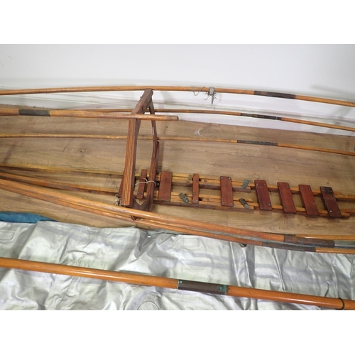 574 - A collapsible wooden Canoe Frame and Paddle