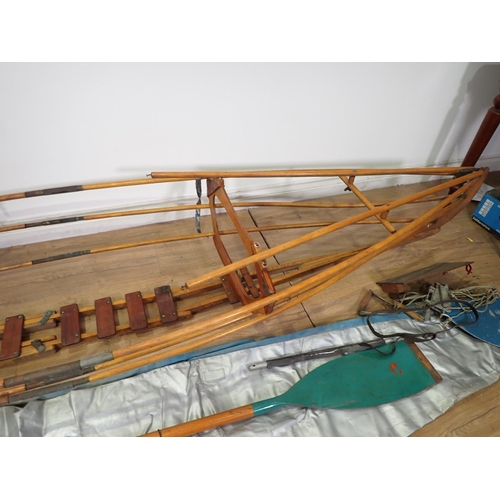 574 - A collapsible wooden Canoe Frame and Paddle