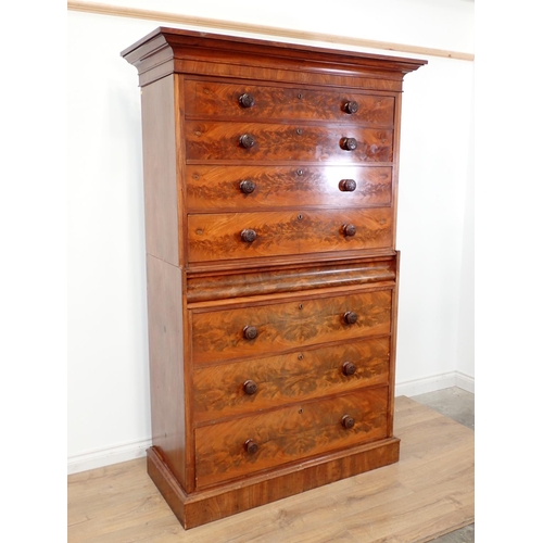 617 - A Victorian flame mahogany Chest on Chest fitted seven graduated drawers on plinth base 6ft 8in x 3f... 