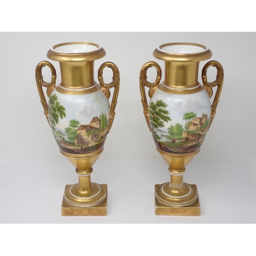 68 - A pair of 19th Century Continental two handled Vases decorated scenes of buildings 12 1/2in H and a ... 