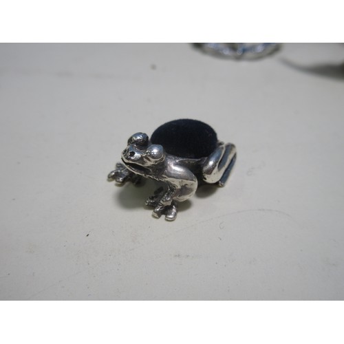 218A - A silver Pin Cushion in the form of a frog, a thistle Brooch, a Pill Box, a claw Brooch, a Brooch, a... 