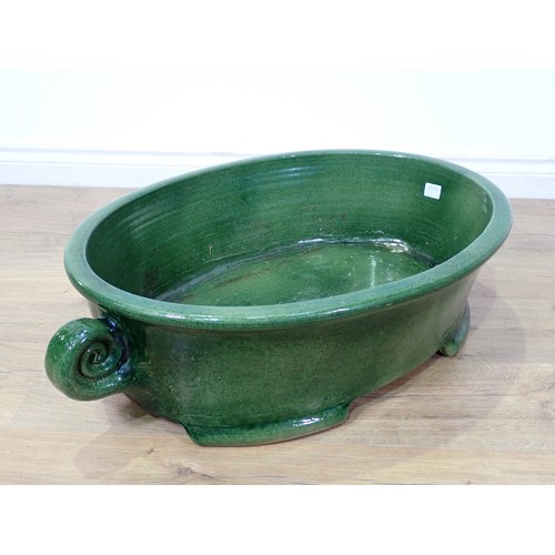 91 - A large green glazed stoneware oval Bowl 2ft 6in W x 8in H