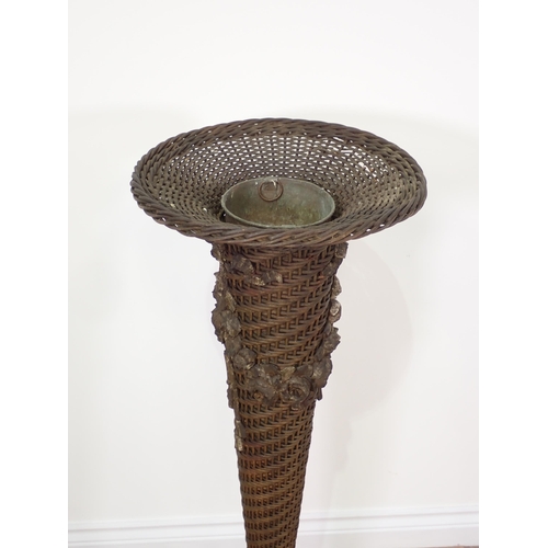 10 - An antique wicker Plant Stand of tapering flared form with metal liner and plaster rose and swag mou... 