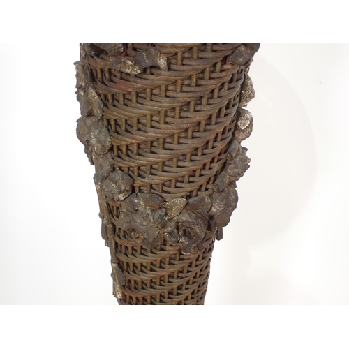 10 - An antique wicker Plant Stand of tapering flared form with metal liner and plaster rose and swag mou... 