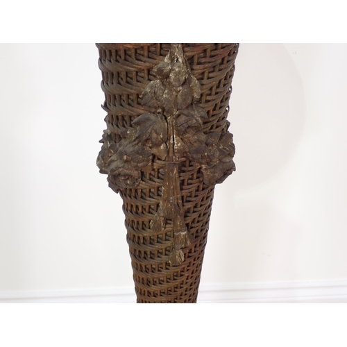 10 - An antique wicker Plant Stand of tapering flared form with metal liner and plaster rose and swag mou... 