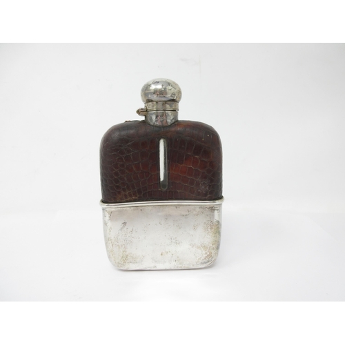 130 - A George V silver and leather mounted Hip Flask engraved with crest, Birmingham 1911