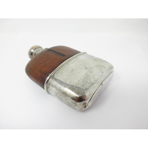 130 - A George V silver and leather mounted Hip Flask engraved with crest, Birmingham 1911