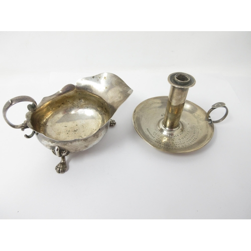 132 - A Victorian silver Chamber Candlestick with presentation inscription, London 1893 and a Sauce Boat o... 