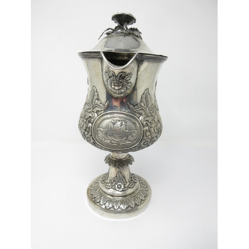 133 - A Continental silver Pedestal Jug with oval reserve of rowing and sailing boats, floral and leafage ... 