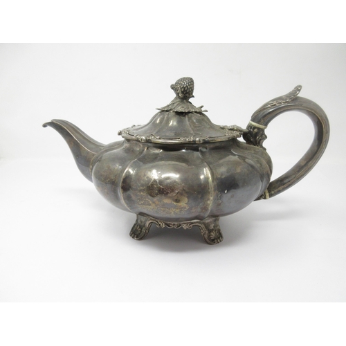 134 - A William IV silver Teapot of melon shape with strawberry finial, on scroll feet, London 1830, maker... 