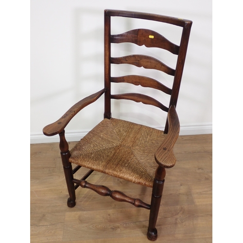 16 - A 19th Century elm rush seated ladderback Elbow Chair