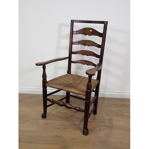 16 - A 19th Century elm rush seated ladderback Elbow Chair