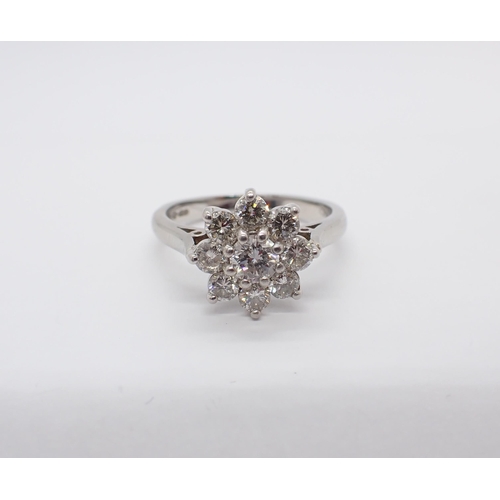 167 - A Diamond Daisy Cluster Ring claw-set brilliant-cut stone, estimated 0.40cts, within a frame of eigh... 