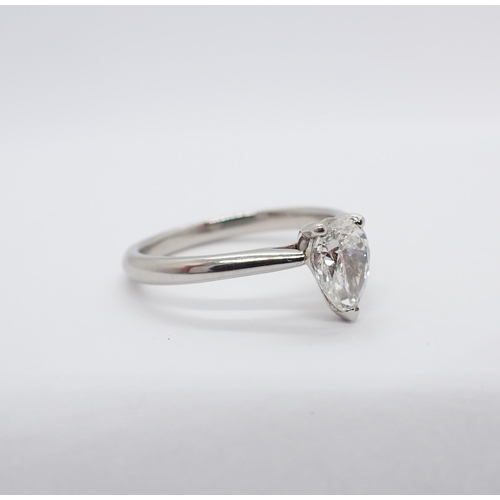 186 - A Diamond single stone Ring claw-set pear-cut stone, 0.90cts, in platinum, ring size P, accompanied ... 