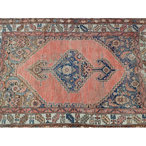 19 - An old Persian Rug 5ft 8in x 3ft 10in