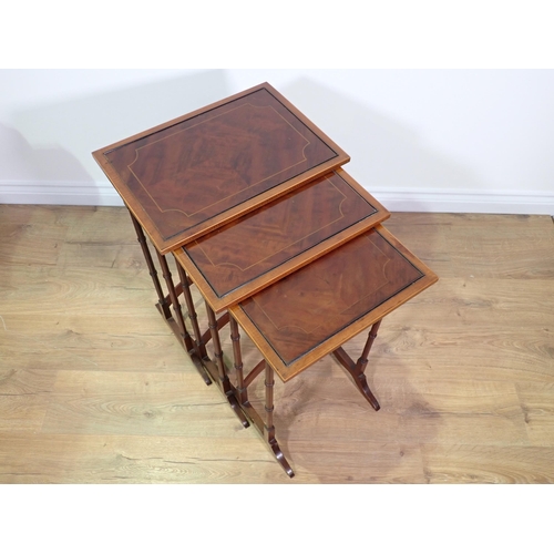 24 - A mahogany and inlaid Nest of three Occasional Tables 2ft 2in x 1ft 6in