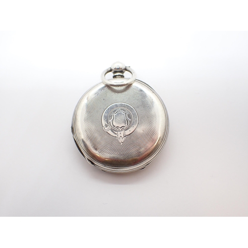 252 - A silver cased half-hunter Pocket Watch the white enamel dial with roman numerals and subsidiary dia... 