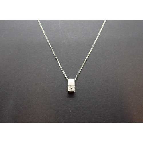 255 - A Diamond Pendant the rectangular drop set four brilliant-cut stones in 18ct white gold on fine Chai... 