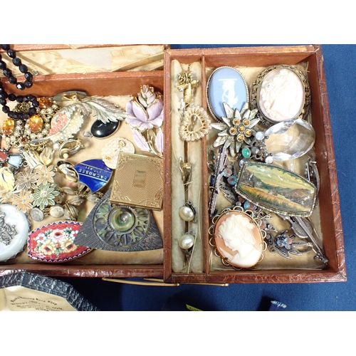 273 - An old Jewel Box containing Costume Jewellery, a part set of enamelled Dress Studs, an old school Ba... 