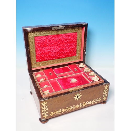 279 - A 19th Century brass mounted walnut Sewing Box with fitted interior containing lace bobbins, etc, 10... 