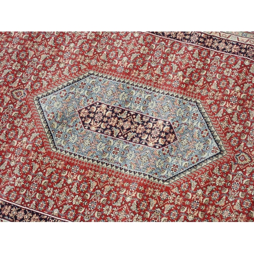 433 - A large modern red ground Carpet with overall floral design within border 14ft 8in L x 7ft 8in W