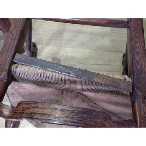 435 - Four antique ladderback Elbow Chairs with rush seats