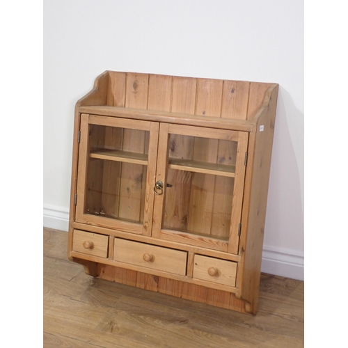 473 - A pine and glazed two door Wall Cabinet 2ft 5in H x 2ft 1in W