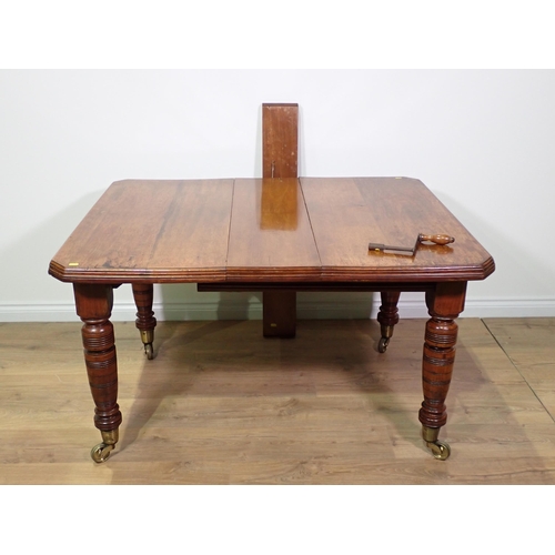 475 - A Victorian walnut extending Dining Table on turned supports 4ft 8in L x 2ft 5in H extended and four... 