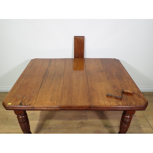 475 - A Victorian walnut extending Dining Table on turned supports 4ft 8in L x 2ft 5in H extended and four... 